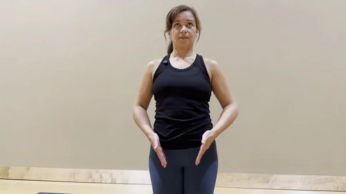 Adult indicating the front of the pelvis during a posture check
