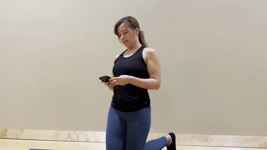 Adult looking down at a smartphone during a screen-heavy day