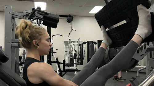 Athlete using a leg press machine through a comfortable range