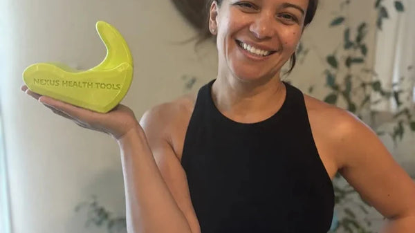 Person holding a psoas release tool during a tool-selection guide
