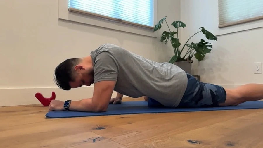 Person using a red Core Nexus on a floor mat