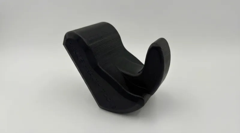 Core Nexus psoas and iliacus release tool showing dual tips — one wider for the psoas, one contoured for the iliacus
